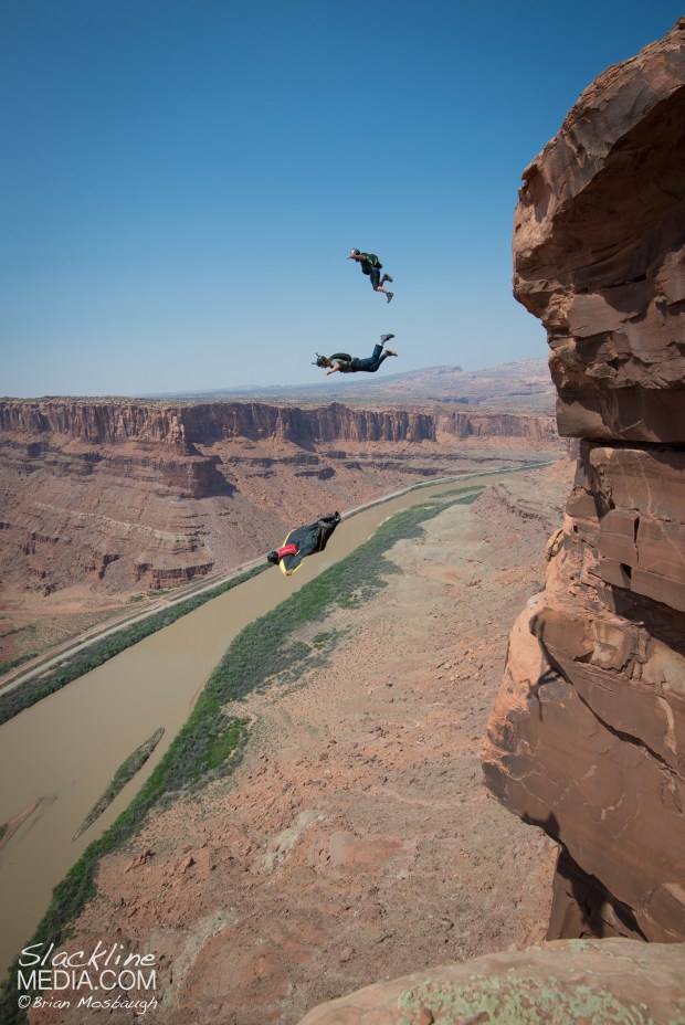 BASE jumpers Andy Lewis and Jimmy Peterson making a leap into the depths below as Graham Hunt leads the way while opening a new wingsuit exit in Moab. 