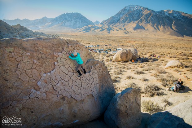 Aleta Edinger dances delicately up the fine patina granite of the Buttermilks bouldering area in Bishop, CA.