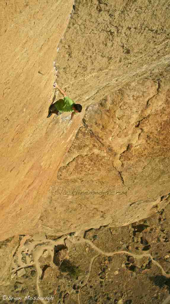 Expanding this week's Photo of the Week vocabulary into the world of free-solo climbing, I bring you one of my favorite shots which was taken hanging 100' from the top of Morning Glory Wall at Smith Rock State Park. Back in the summer of 2012, on sweltering 90 degree day, Scott Bennett and Brad Gobright decided to test their wits with an on-sight ascent, no ropes necessary, climb of the classic Zebra Zion route. These two elite climbers aren't new to the world of ropeless climbing and were doing so well below their physical limit and previous experience of climbing big walls. Much respect and appreciation for their boldness and talent!
