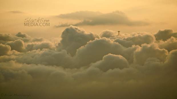 Jesus emerges from the clouds at sunset to get a glimpse of highlining